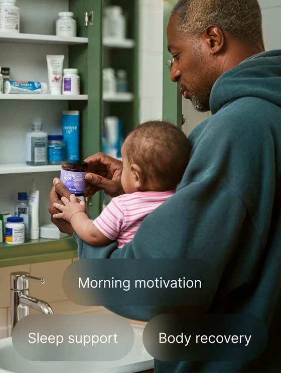 Man holding a baby and a jar of supplements