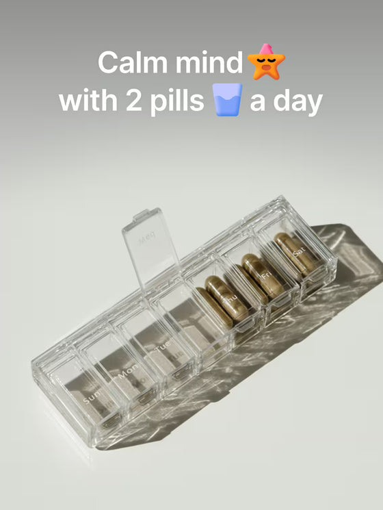 Clear pill organizer with gold pills on a light gray background, accompanied by text and emojis.